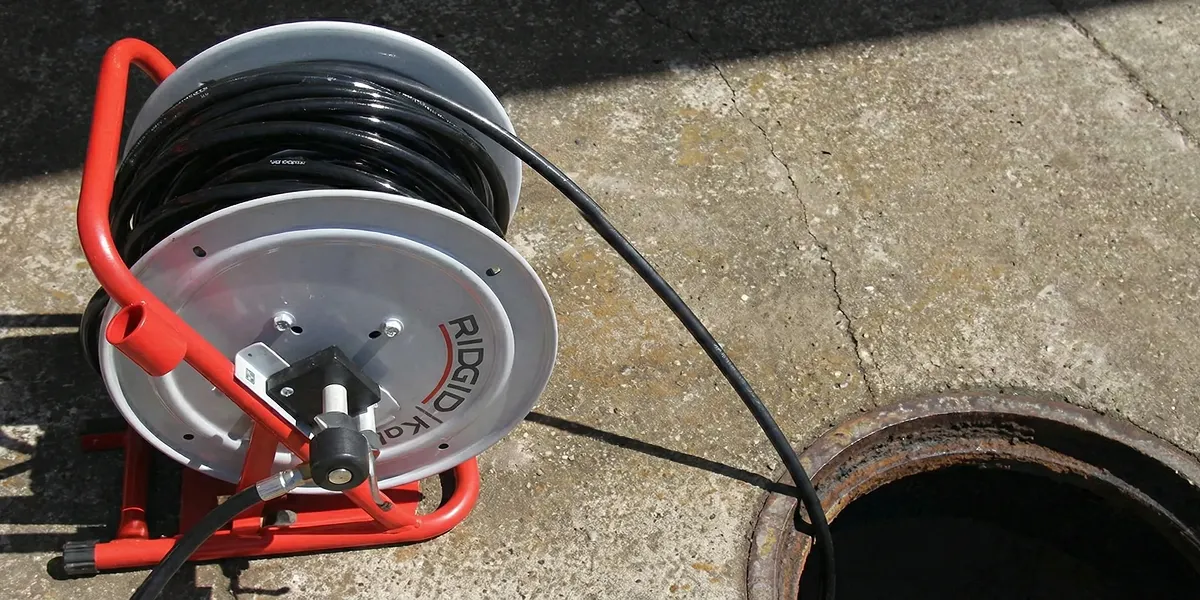 sewer rodding equipment prepared to clear clogged sewer lines in Tampa, FL