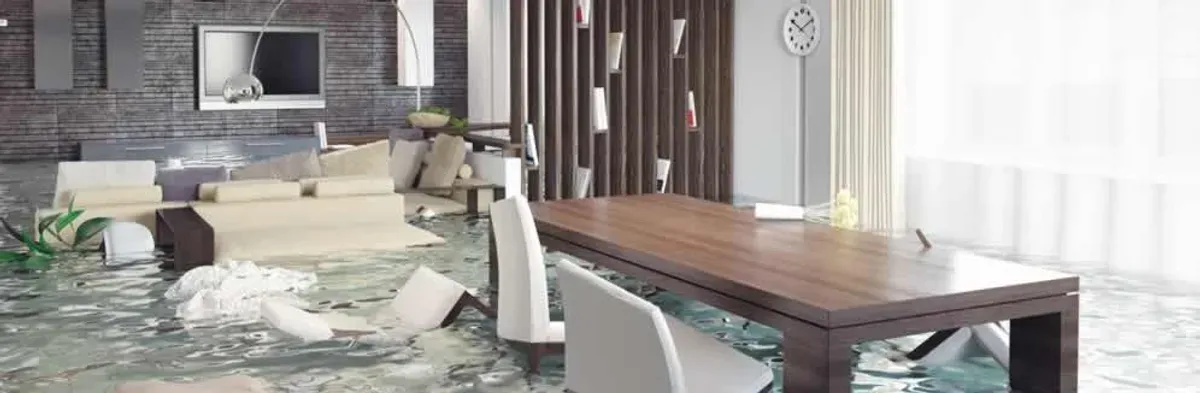 home interior affected by water damage with flooded floors and displaced furniture in Tampa, FL